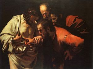 Caravagio's 'The incredulity of Saint Thomas'.  Although today commentators think that Thomas did not in fact touch Jesus' wounds as it is not mentioned in scripture that he did, it was a long-held view that he did. (Wiki Commons http://en.wikipedia.org/wiki/File:Caravaggio_-_The_Incredulity_of_Saint_Thomas.jpg)